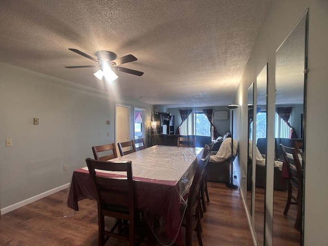 dining room featuring ceiling fan, dark hardwood / wood-style flooring, and a textured ceiling