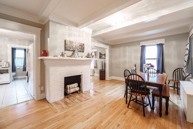 71 Daviston St, Springfield, MA 01108 - dining area featuring beam ceiling, ornamental molding, healthy amount of natural light, light wood-style floors, and baseboards