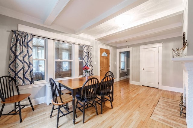 71 Daviston St, Springfield, MA 01108 - dining space with beamed ceiling, light wood-style floors, baseboards, healthy amount of natural light, and a fireplace