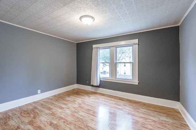 71 Daviston St, Springfield, MA 01108 - unfurnished room with ornamental molding, light wood-style floors, an ornate ceiling, and baseboards