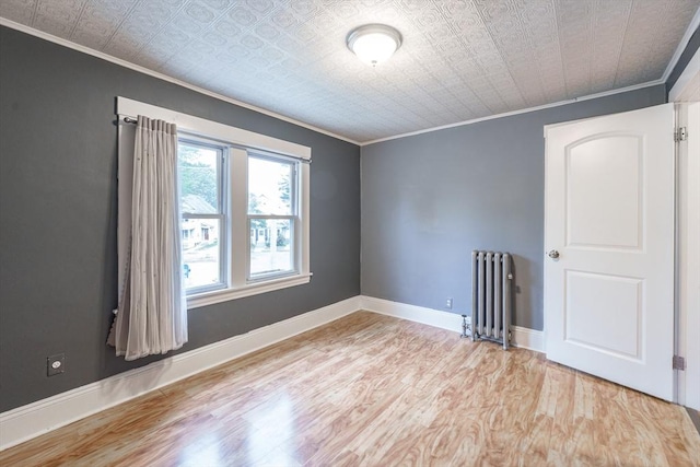 71 Daviston St, Springfield, MA 01108 - unfurnished room featuring radiator heating unit, crown molding, wood finished floors, baseboards, and an ornate ceiling