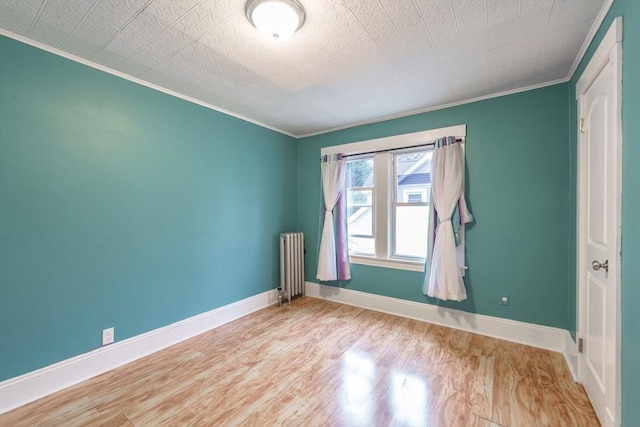 71 Daviston St, Springfield, MA 01108 - unfurnished room with radiator, crown molding, wood finished floors, and baseboards