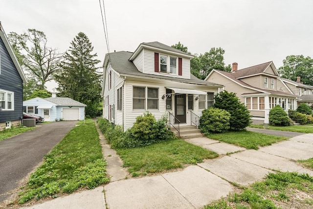71 Daviston St, Springfield, MA 01108 - view of front of home with an outbuilding, a detached garage, and driveway