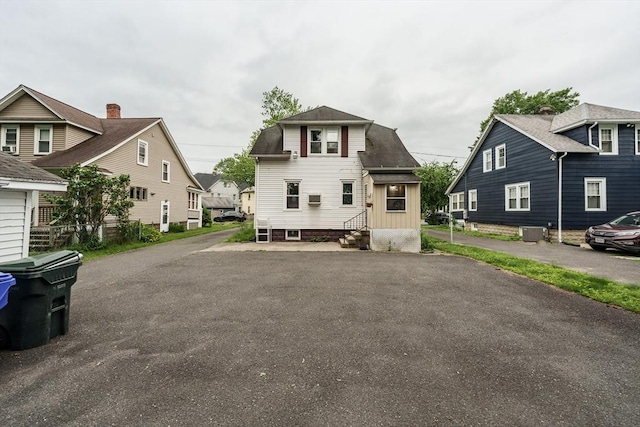 71 Daviston St, Springfield, MA 01108 - view of front of house with entry steps, central air condition unit, and a residential view