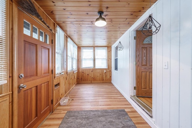 71 Daviston St, Springfield, MA 01108 - foyer entrance with light wood-style floors, wooden walls, wooden ceiling, and baseboards