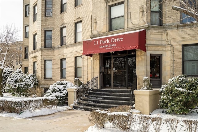 view of snow covered property entrance