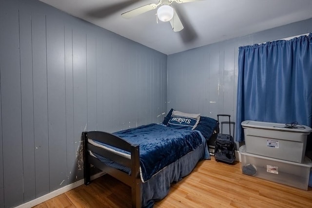 bedroom featuring wood finished floors and ceiling fan