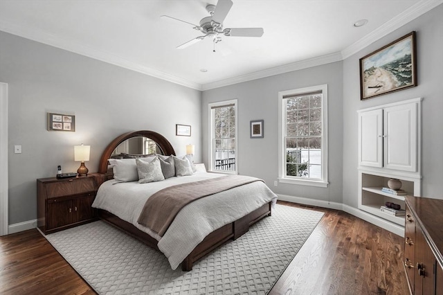 bedroom featuring ornamental molding, wood finished floors, a ceiling fan, and baseboards