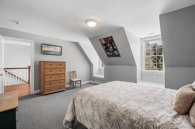 bedroom featuring carpet floors, visible vents, vaulted ceiling, and baseboards