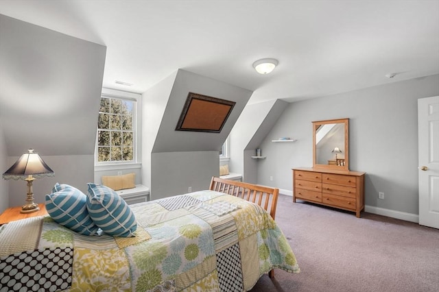 carpeted bedroom with lofted ceiling, visible vents, and baseboards