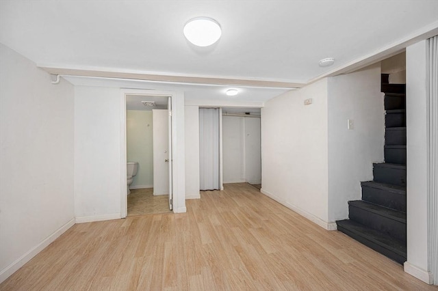 basement featuring light hardwood / wood-style flooring