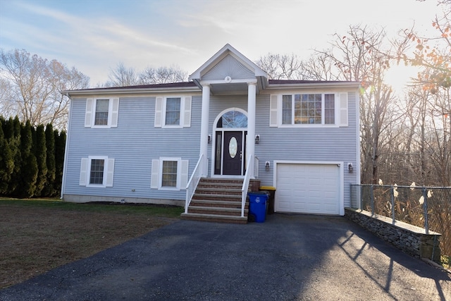 split foyer home featuring a garage