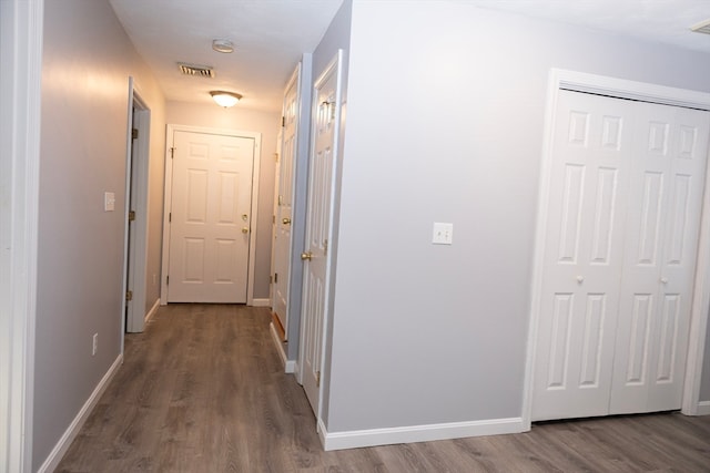 corridor featuring hardwood / wood-style floors