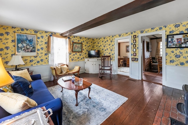 living room featuring beam ceiling and dark wood-type flooring