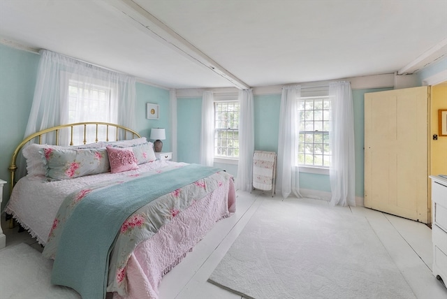 bedroom featuring beam ceiling