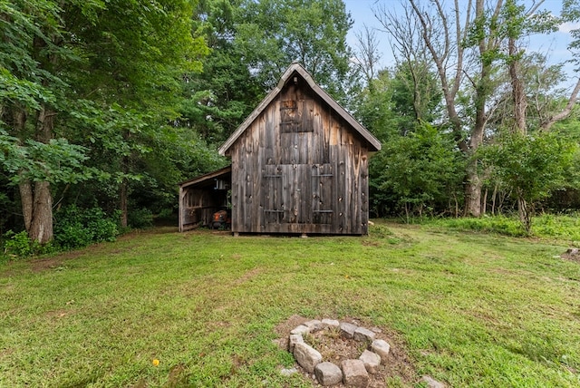 view of outdoor structure featuring a lawn