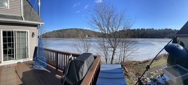 wooden deck with a water view