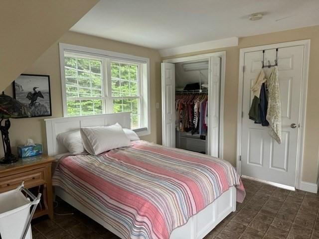 bedroom featuring lofted ceiling