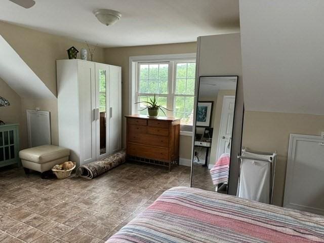 bedroom featuring vaulted ceiling