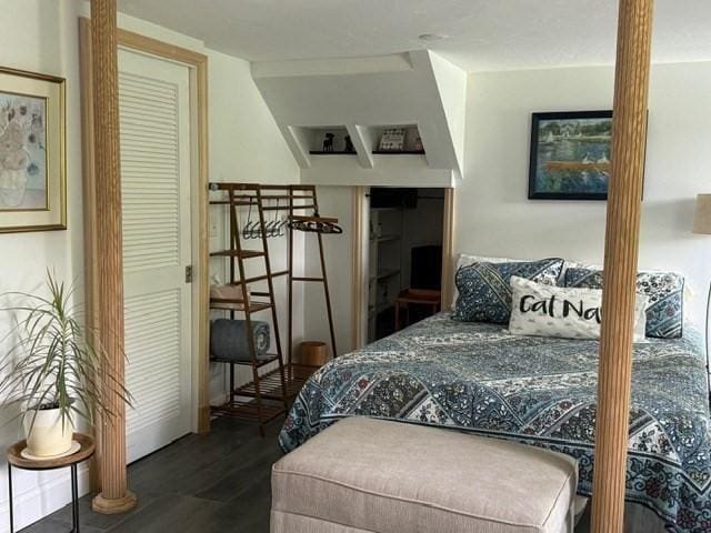 bedroom featuring dark wood-type flooring