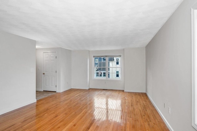 unfurnished room featuring light hardwood / wood-style floors