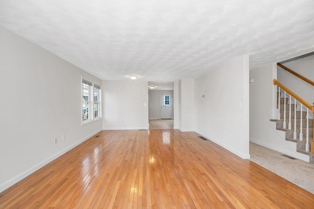 unfurnished room with light hardwood / wood-style floors