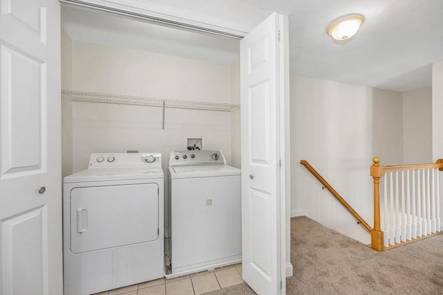 laundry room featuring light carpet and independent washer and dryer