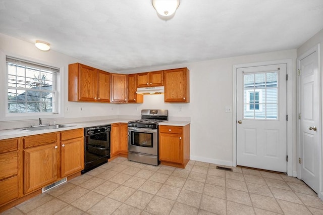 kitchen featuring black dishwasher, gas stove, and sink