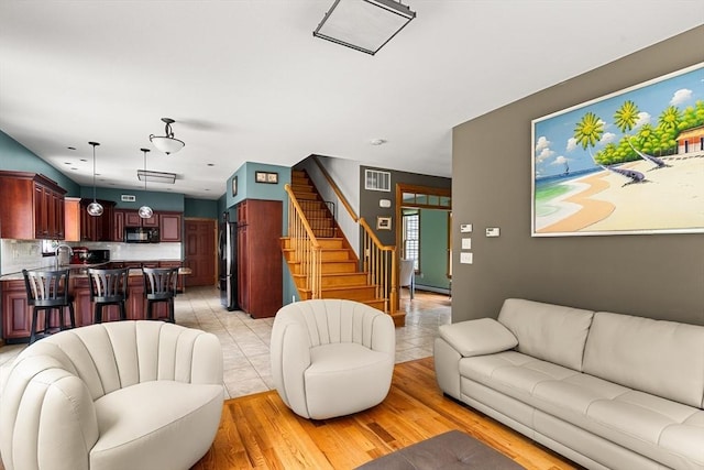 294 Cardinal Way, Northampton, MA 01062 - living area with stairway and light wood-style flooring