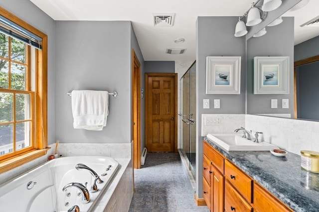 294 Cardinal Way, Northampton, MA 01062 - full bath with vanity, a shower stall, a tub with jets, and a baseboard radiator