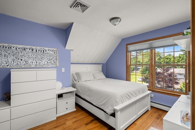 294 Cardinal Way, Northampton, MA 01062 - bedroom featuring a baseboard heating unit, light wood finished floors, and vaulted ceiling