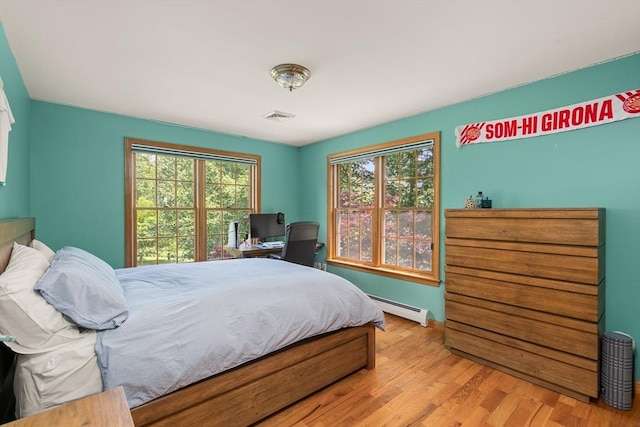 294 Cardinal Way, Northampton, MA 01062 - bedroom featuring a baseboard radiator and wood finished floors
