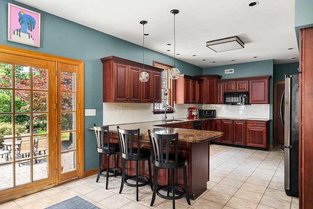 294 Cardinal Way, Northampton, MA 01062 - kitchen with black appliances, a peninsula, backsplash, light tile patterned floors, and pendant lighting