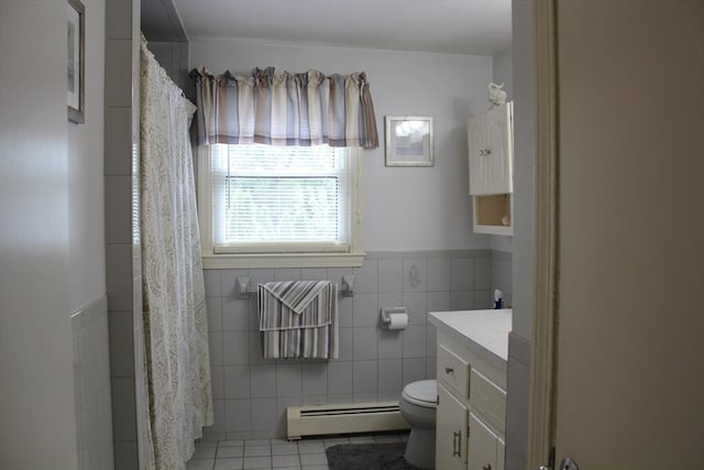 276 Newport Ave, Attleboro, MA 02703 - bathroom with a baseboard heating unit, tile patterned flooring, tile walls, vanity, and a shower with curtain