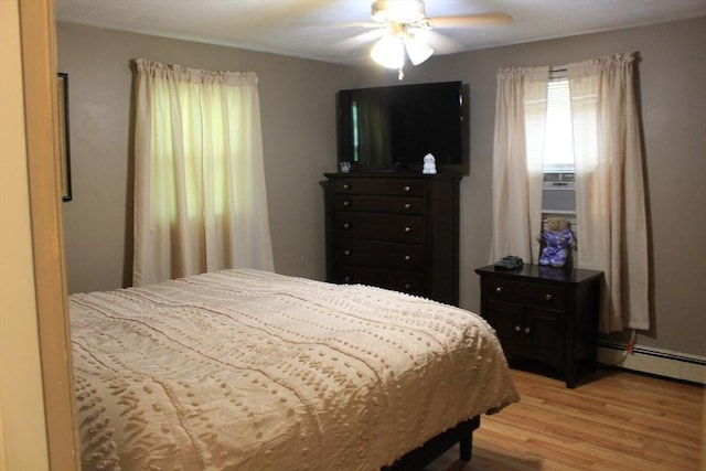 276 Newport Ave, Attleboro, MA 02703 - bedroom featuring a baseboard radiator, light wood-style flooring, a ceiling fan, and cooling unit