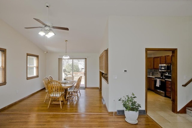 dining space featuring visible vents, a ceiling fan, and light wood finished floors