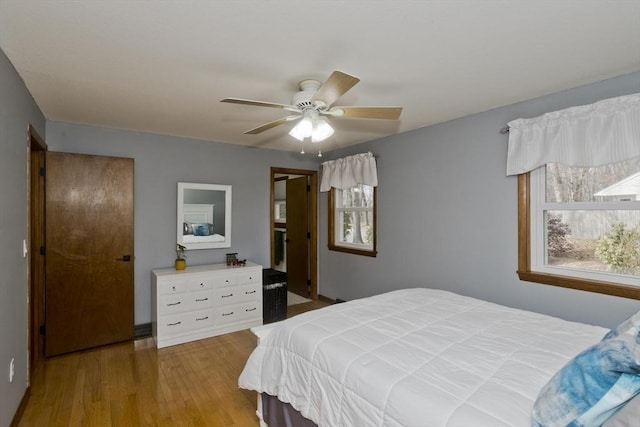 bedroom featuring ceiling fan and wood finished floors