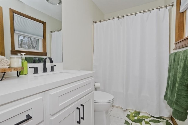 bathroom featuring vanity, tile patterned floors, toilet, and a shower with curtain