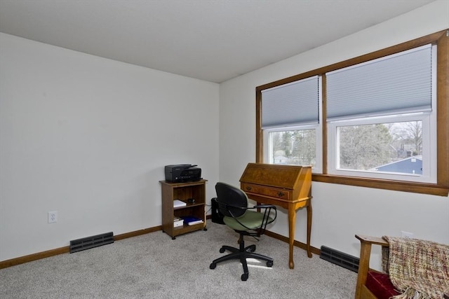 carpeted office space with baseboards