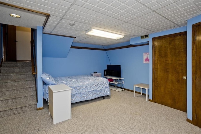 bedroom with carpet, visible vents, and baseboards