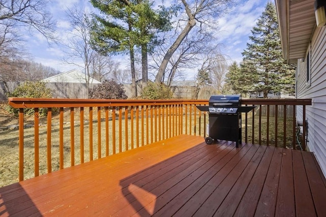 wooden deck with a grill