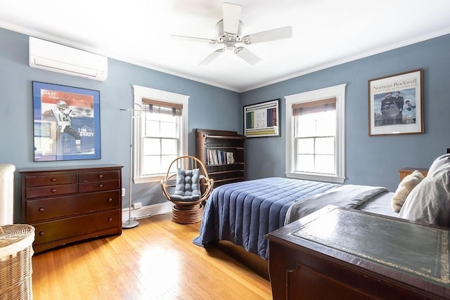 bedroom featuring a wall mounted AC, multiple windows, light wood-type flooring, ornamental molding, and ceiling fan