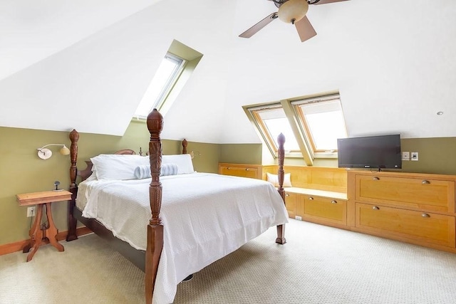 bedroom with lofted ceiling, light carpet, and a ceiling fan