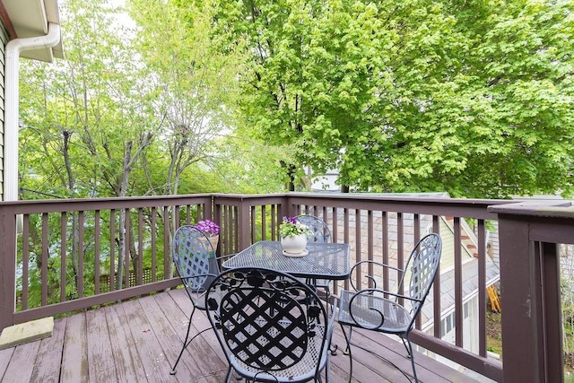 wooden deck featuring outdoor dining space