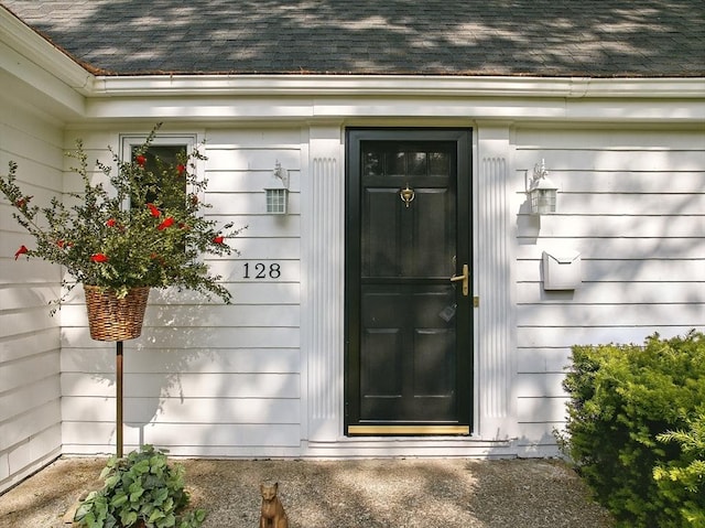 128 Lovell Rd, Holden, MA 01520 - view of exterior entry with roof with shingles