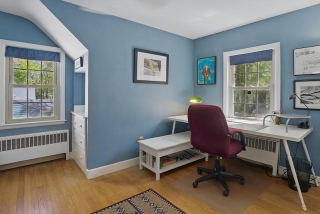 128 Lovell Rd, Holden, MA 01520 - home office featuring radiator heating unit, plenty of natural light, and light wood-type flooring