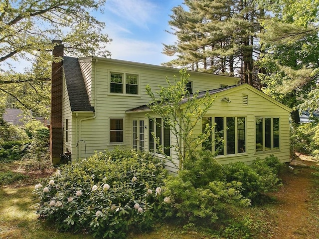 128 Lovell Rd, Holden, MA 01520 - rear view of property with a chimney and roof with shingles