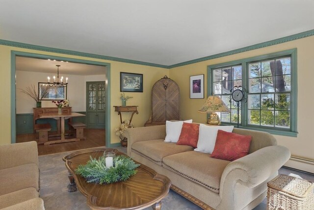 128 Lovell Rd, Holden, MA 01520 - living room featuring a chandelier, wood finished floors, and a baseboard radiator