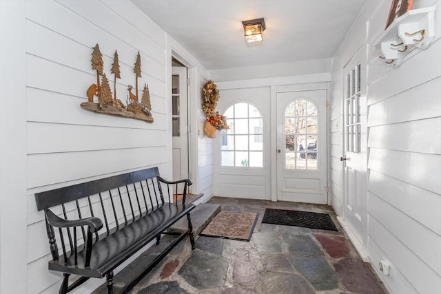 doorway with wooden walls