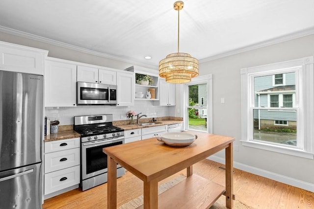 12 Short St, Cohasset, MA 02025 - kitchen featuring appliances with stainless steel finishes, tasteful backsplash, white cabinets, crown molding, and open shelves